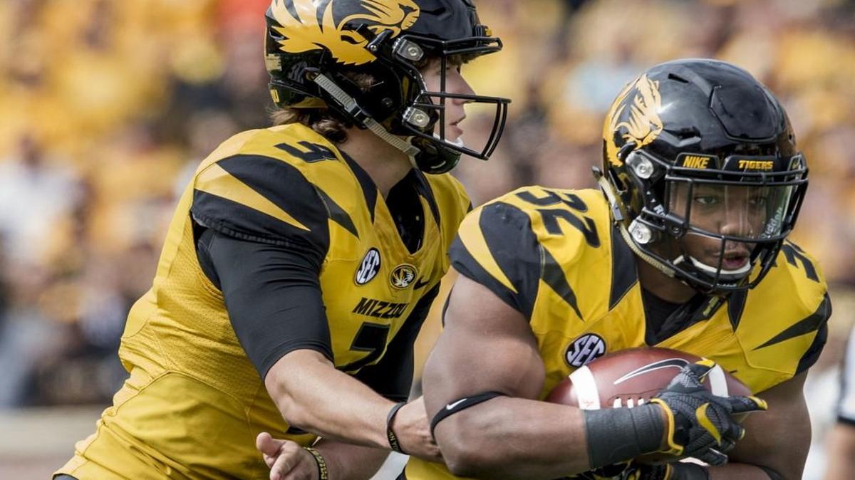 
Tigers running back Russell Hansbrough (right) took the ball from quarterback Drew Lock in Missouri’s game against South Carolina on Oct. 3.

