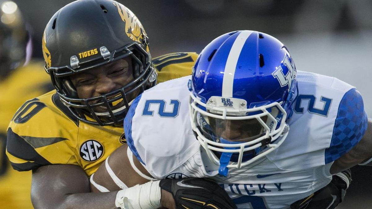 
Missouri Tigers linebacker Kentrell Brothers wrapped up Kentucky Wildcats wide receiver Dorian Baker during a game last November.
