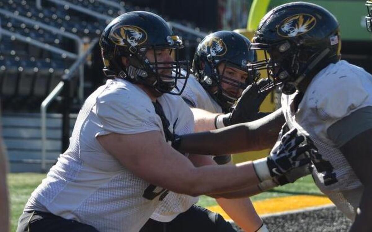 Back in 2011, Mizzou junior offensive lineman Adam Ploudre (left) was hospitalized after breaking bones in his left leg on the final play of a high school football scrimmage.