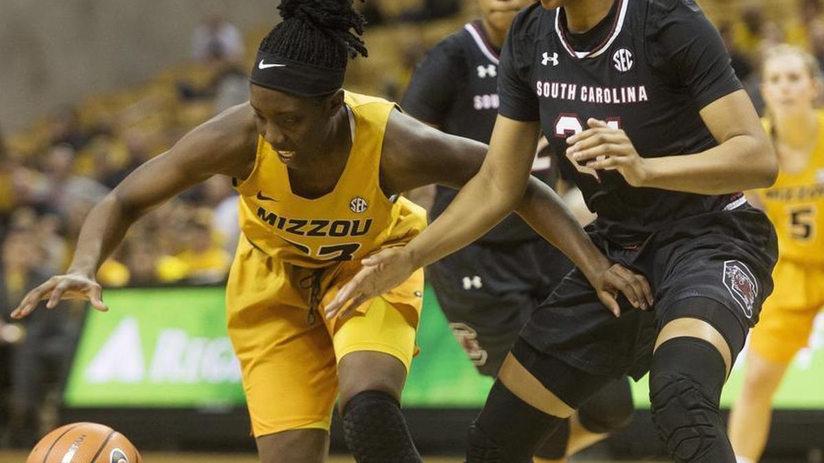 Missouri’s Amber Smith, left, and South Carolina’s Lele Grissett, right, battle for the ball during the first half of an NCAA college basketball game Sunday, Jan. 7, 2018, in Columbia, Mo. Mizzou won 83-74.
