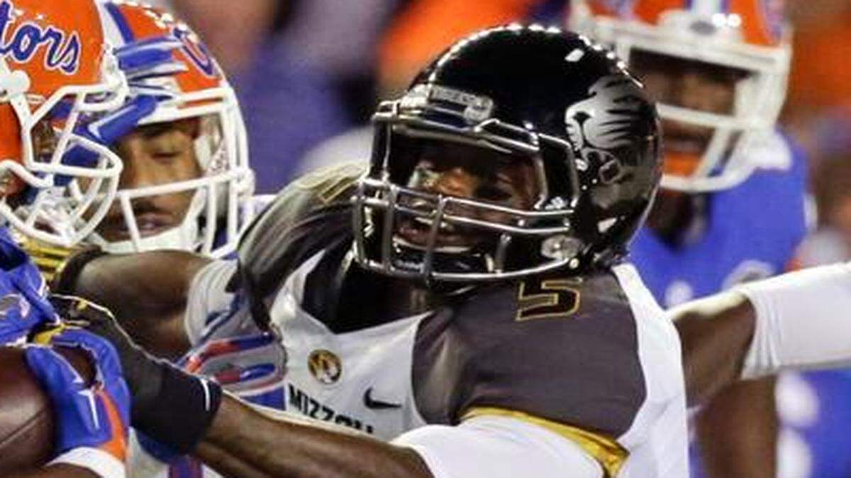 
Missouri safety Cortland Browning (right).
