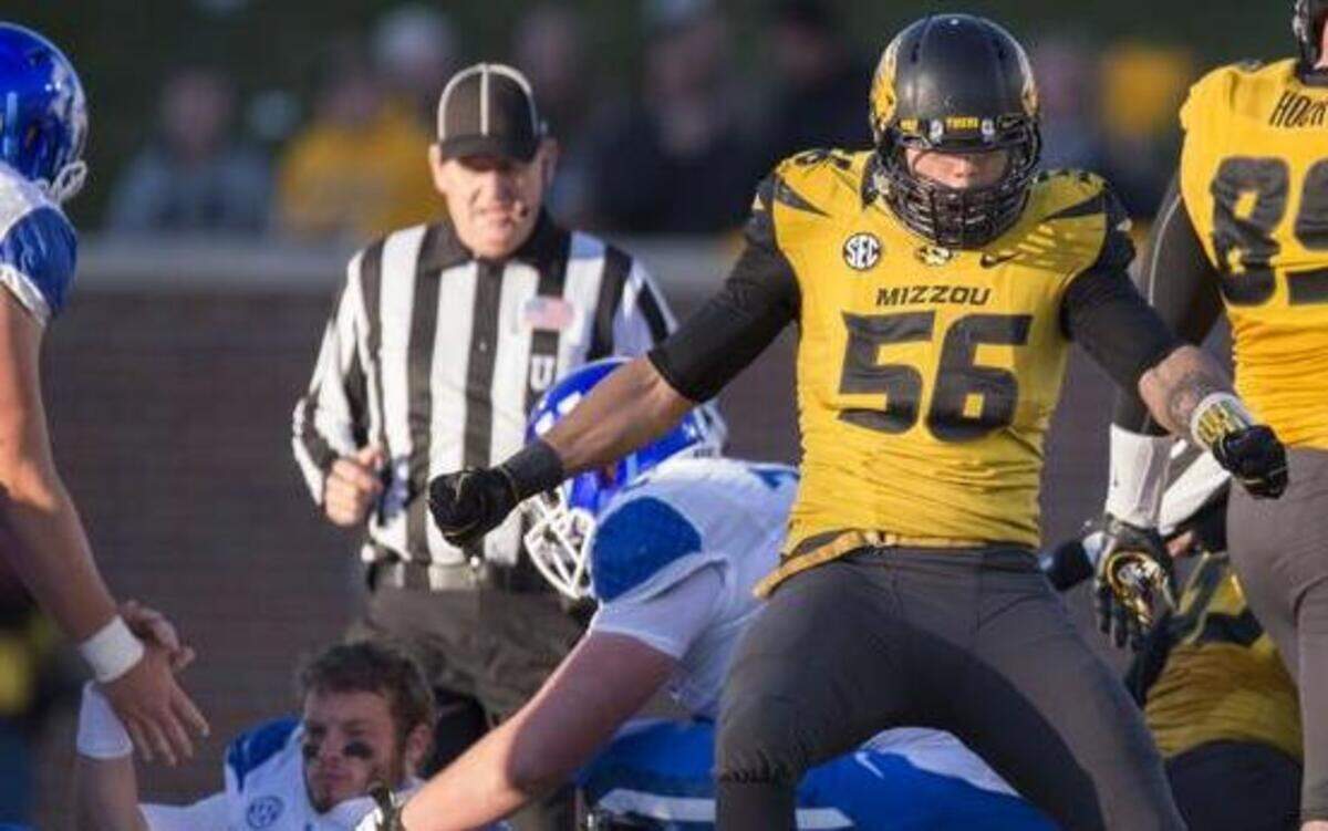 
Missouri Tigers defensive lineman Shane Ray celebrated the first of his two second-half sacks as Kentucky Wildcats center Jon Toth (left) and tackle Jordan Swindle helped quarterback Patrick Towles off the turf in the third quarter on Nov. 1 in Columbia. Missouri beat Kentucky 20-10, and Ray set a Missouri record for sacks in a single season on the Tigers’ last defensive play of the game.
