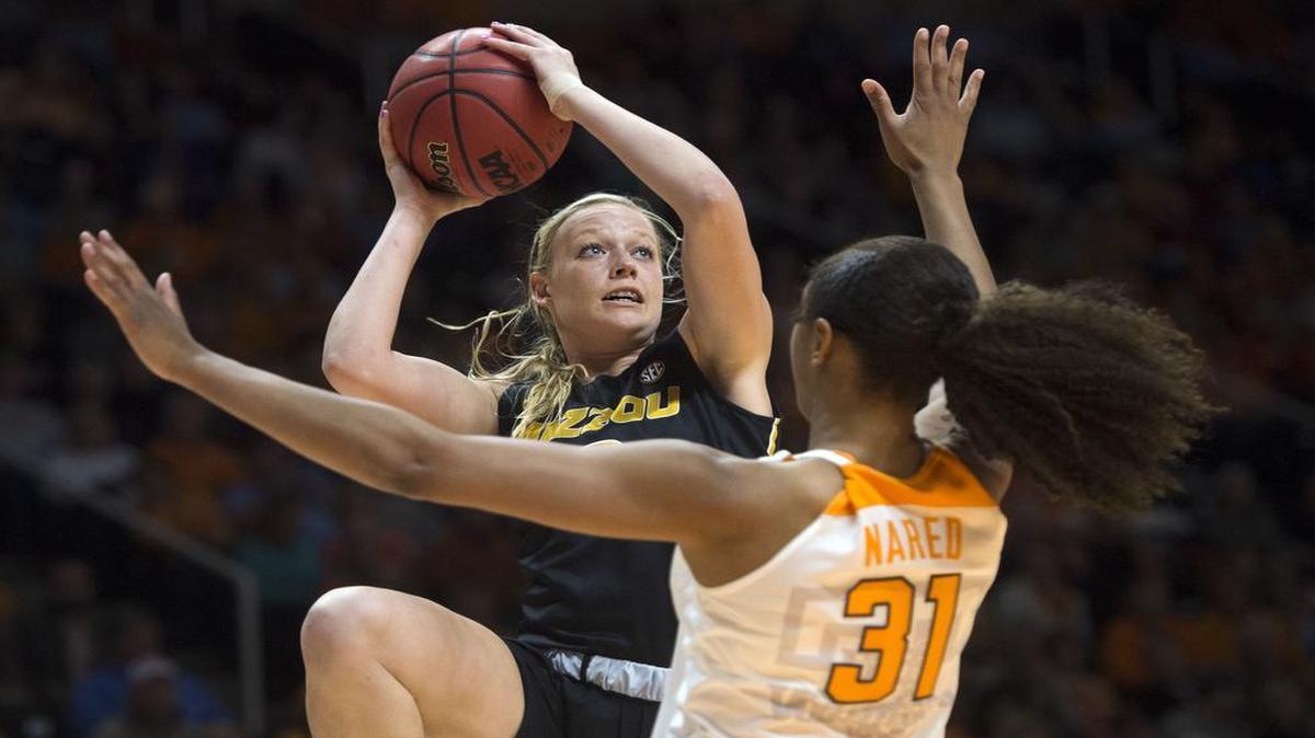 Missouri's Sophie Cunningham shoots while defended by Tennessee's Jaime Nared during a game in Knoxville, Tenn., on Thursday, Feb. 9, 2017.