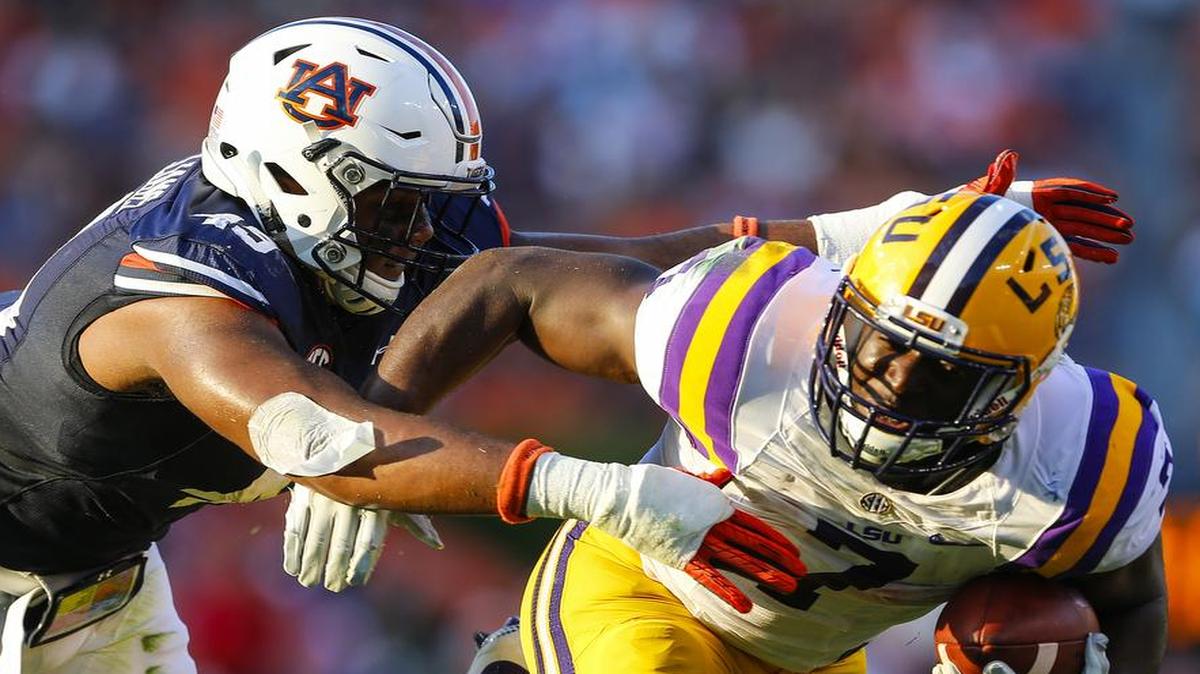 LSU running back Leonard Fournette (right) has rushed for at least 100 yards in 15 of the last 17 games he’s played, but he will be a game-time decision against Missouri because of a nagging ankle injury.