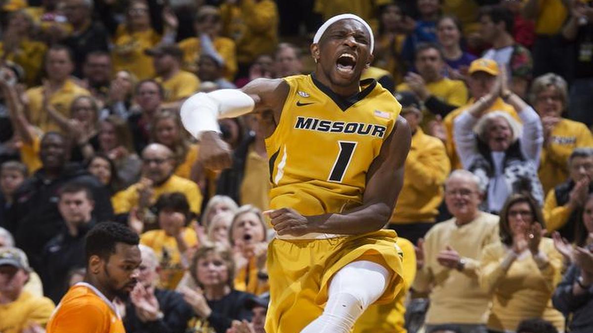 Missouri's Terrence Phillips, right, celebrates a basket in front of Tennessee's Kevin Punter, left, during the second half of an NCAA college basketball game, Saturday, Feb. 13, 2016, in Columbia, Mo. Missouri won the game 75-64.