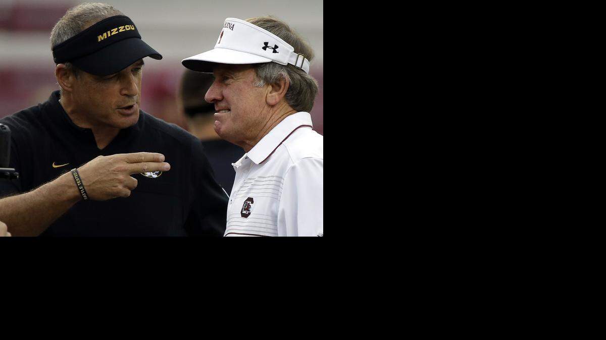 
Two weeks after upsetting coach Steve Spurrier (right) and the South Carolina Gamecocks, coach Gary Pinkel and the Missouri Tigers hope to do the same Saturday to the No. 13-ranked Georgia Bulldogs. CBS will televise the game, starting at 11 a.m.
