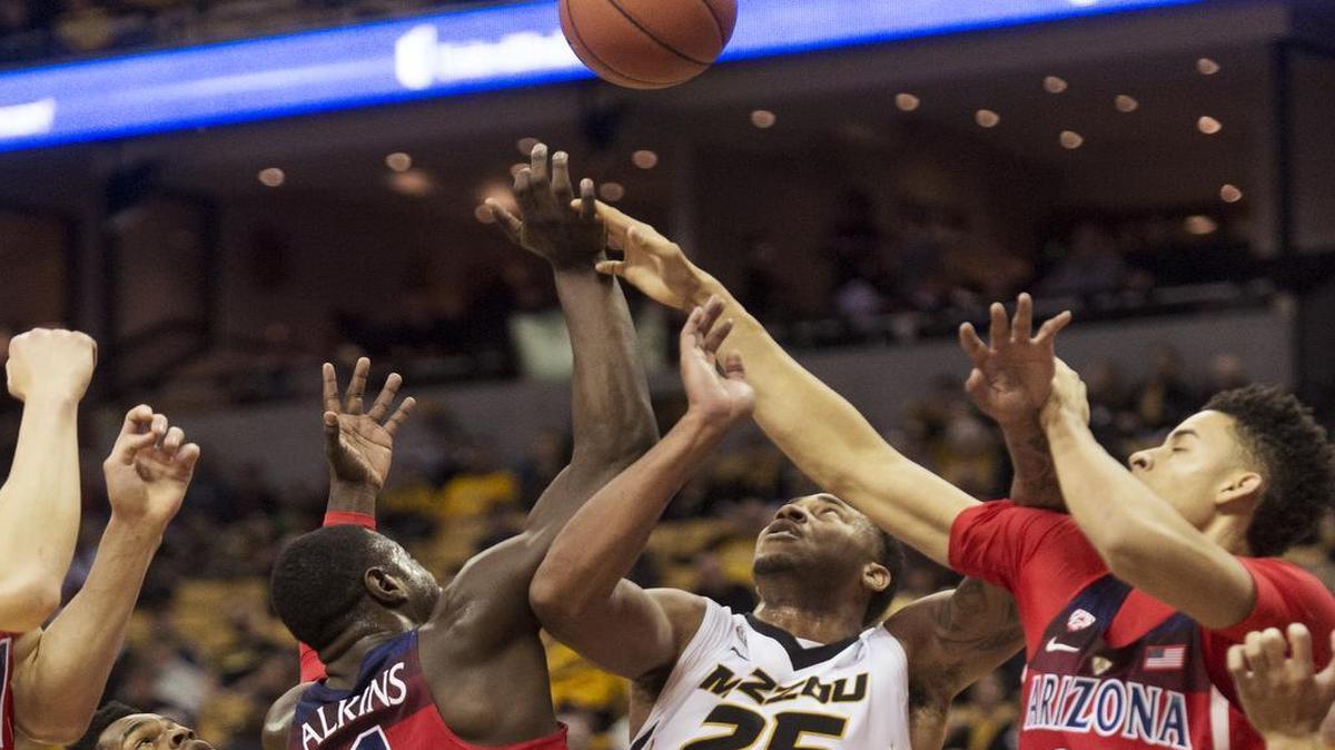 Missouri's Mitchell Smith, from left, Rawle Alkins, Russell Woods, and Chance Comanche battle for rebound during the first half of an NCAA college basketball game Saturday, Dec. 10, 2016, in Columbia, Mo.