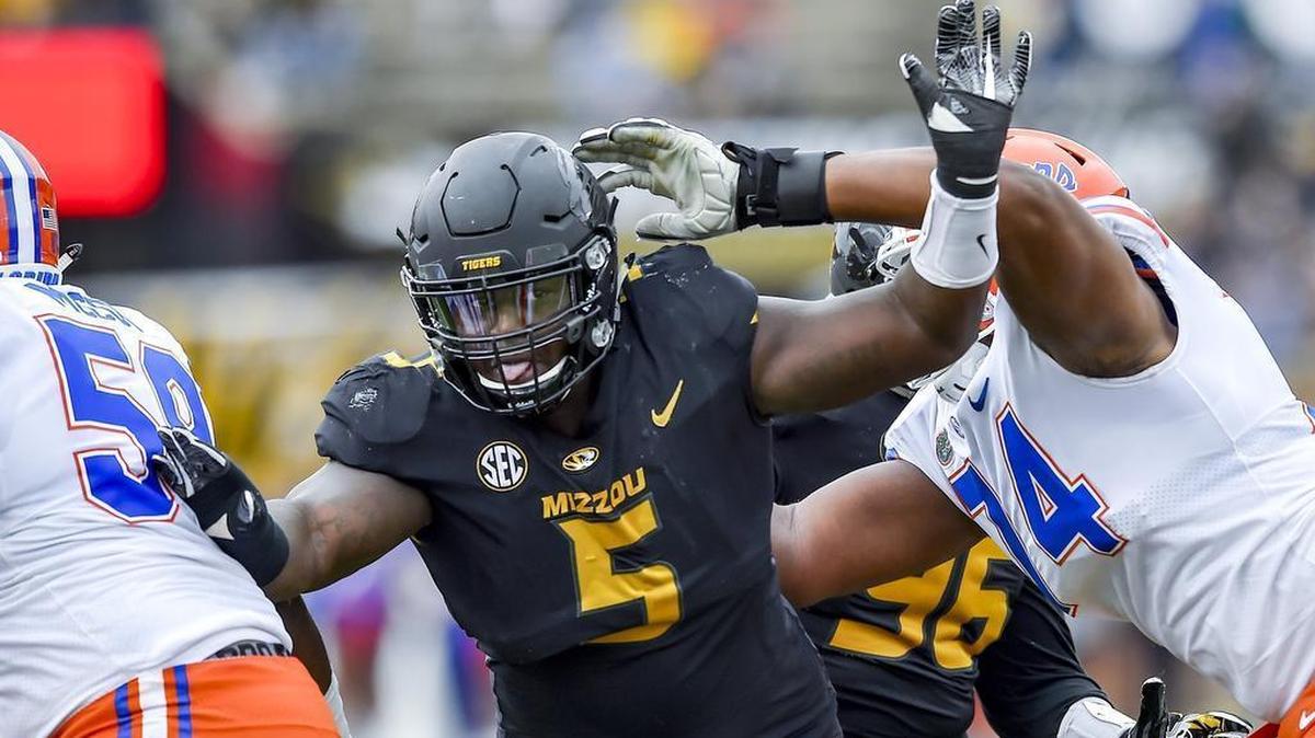 Missouri Tigers defensive lineman Terry Beckner Jr. (5) pushed through Florida Gators linebackers Danny Weldon (59) and Fred Johnson (74) during the first half on Saturday, Nov. 4, 2017, at Memorial Stadium.