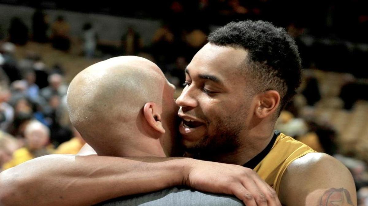 Missouri’s Russell Woods hugs assistant coach Brad Loos following their 83-78 win over Arkansas on Saturday in Columbia, Mo.