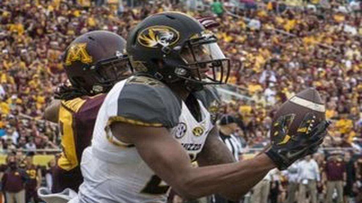 
Mizzou wide receiver Bud Sasser caught a touchdown pass in front of Minnesota defensive back Briean Boddy-Calhoun in the second quarter of the Citrus Bowl Thursday near Orlando, Fla.
