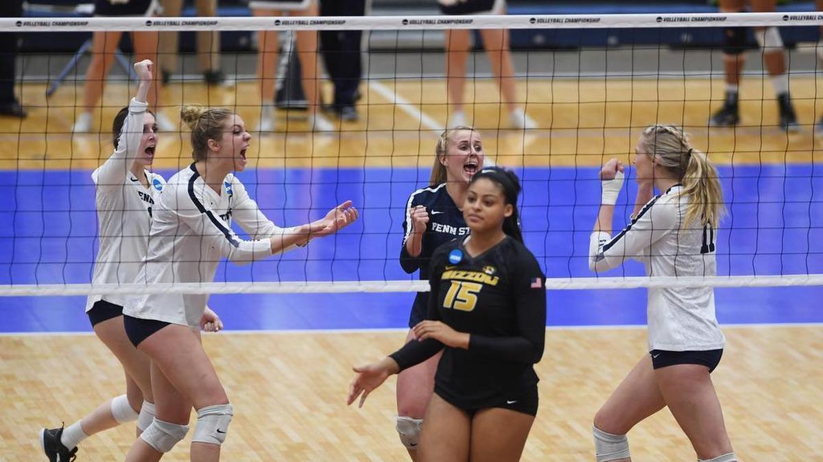 Penn State volleyball team members celebrate winning a point during Friday’s NCAA Sweet 16 match against Missouri at Rec Hall in University Park, Pa.