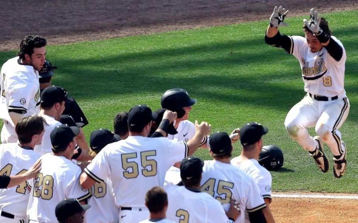 
Vanderbilt’s Rhett Wiseman (8) jumped in celebration as he approached home plate after he hit a walk-off home run in the 10th inning as the Commodores defeat Missouri 7-6 in the SEC Baseball Tournament on Wednesday at the Hoover Met in Hoover, Ala.
