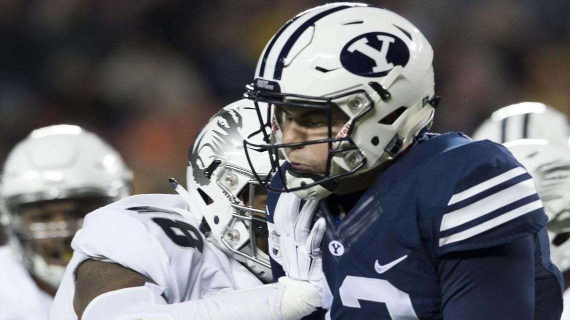 Missouri Tigers defensive lineman Josh Moore got to Brigham Young Cougars quarterback Tanner Mangum during a game in 2015.
