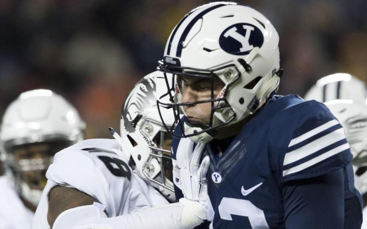 Missouri Tigers defensive lineman Josh Moore got to Brigham Young Cougars quarterback Tanner Mangum during a game in 2015.