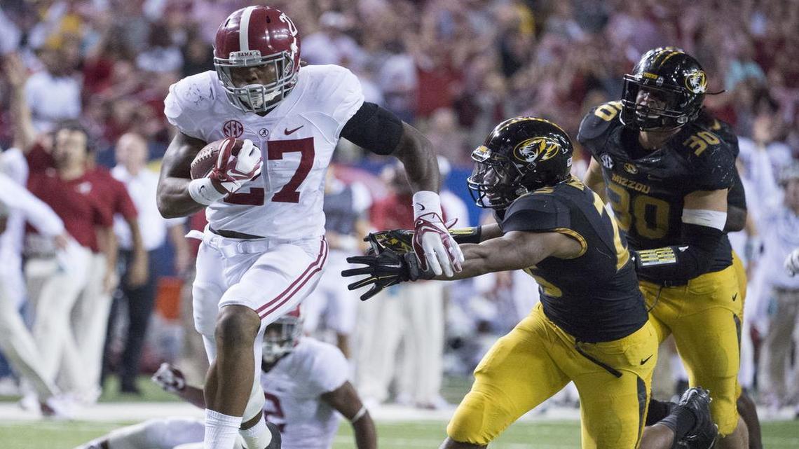 Missouri’s A.J. Logan (center) and Michael Scherer tried to catch Alabama running back Derrick Henry in the 2014 SEC Championship Game. Logan has been suspended six games this season by the NCAA as part of its ongoing review of academic fraud allegations that surfaced last November.