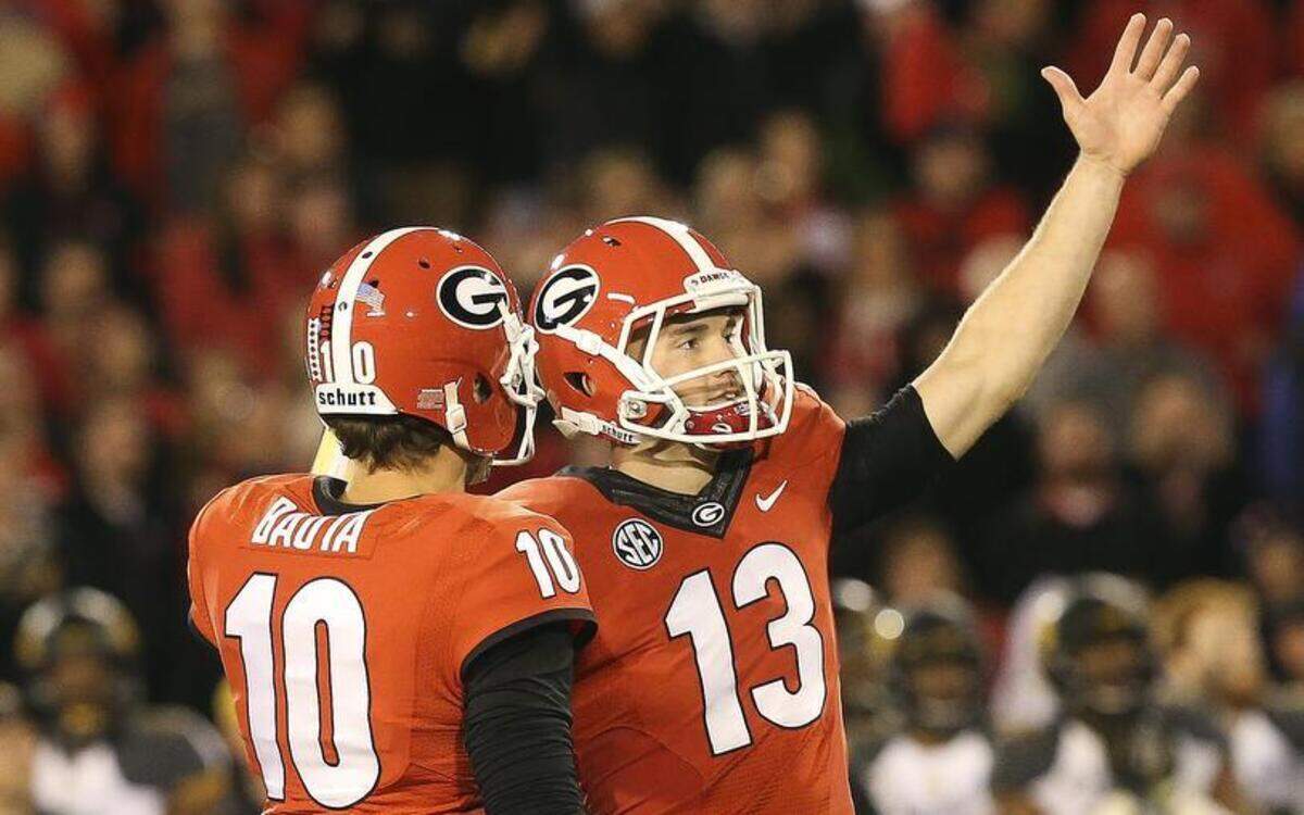 Georgia placekicker Marshall Morgan (13) celebrates with holder Faton Bauta after putting Georgia ahead with a field goal late in the second half of an NCAA college football game against Missouri  Saturday, Oct. 17, 2015, in Athens, Ga. Georgia won 9-6.