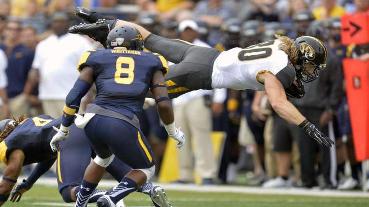 
Missouri tight end Sean Culkin (80) leaps in the air after making a catch against the Toledo in the first quarter of an NCAA college football game in Toledo, Ohio, Saturday, Sept. 6, 2014. 
