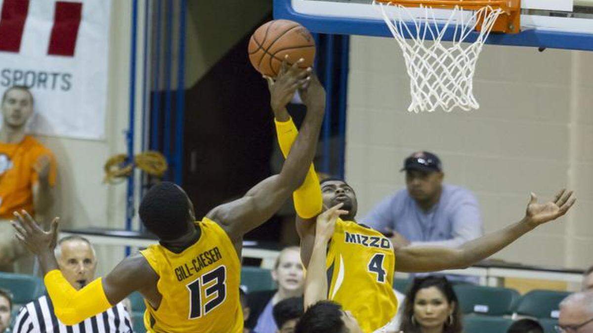 
Missouri guards Montaque Gill-Caesar (left) and Tramaine Isabell each tried for a rebound while playing against Chaminade on Wednesday.
