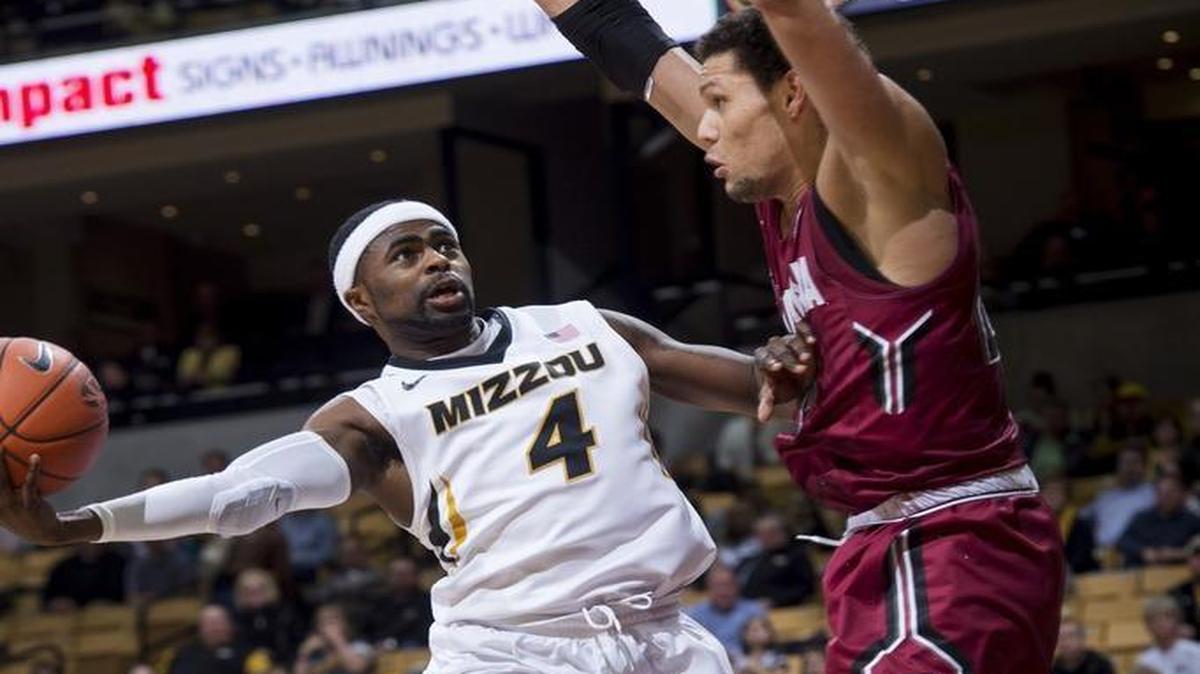 Missouri’s Tramaine Isabell (left) drove to the net defended by South Carolina’s Michael Carrera in the first half as the Tigers and Gamecocks played Tuesday night at Mizzou Arena in Columbia.
