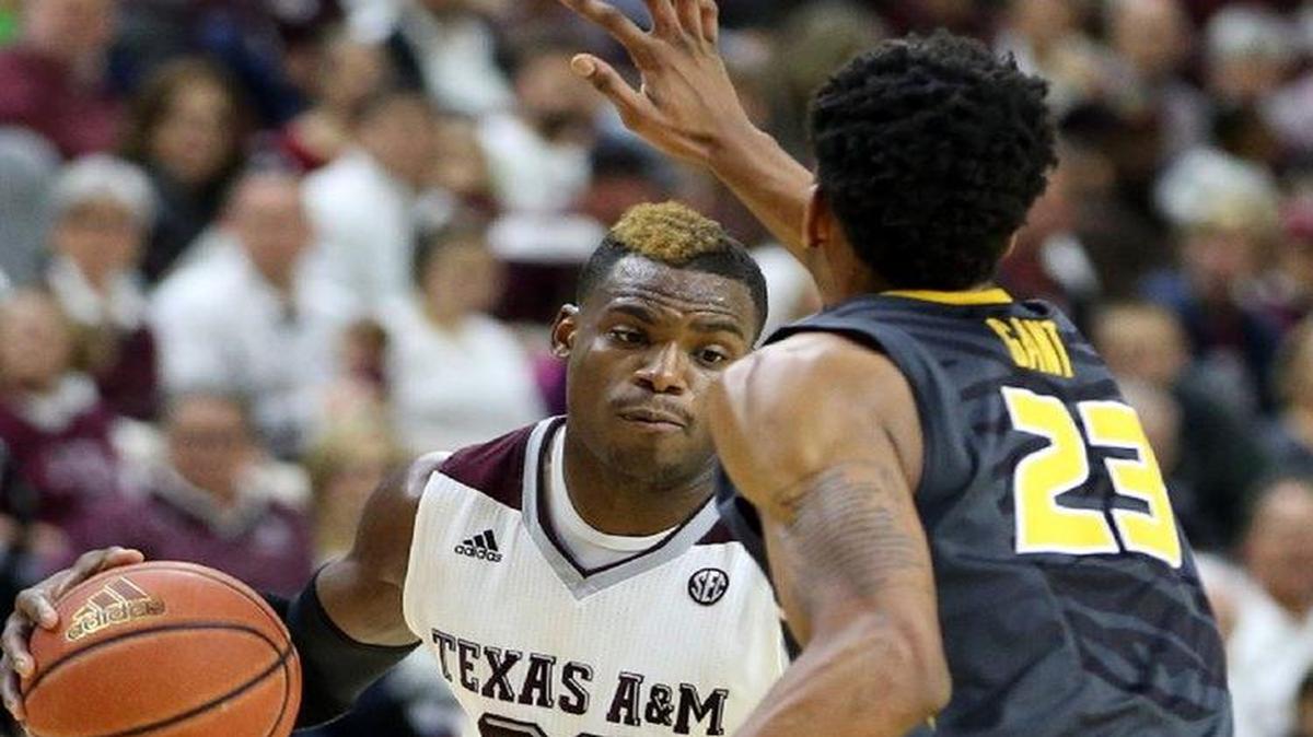 Jakeenan Gant (right) and the Tigers played tough defense against Danuel House and Texas A&M.