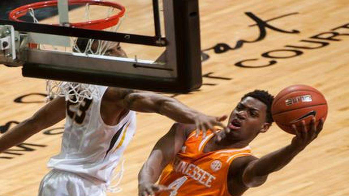 
Tennessee’s Armani Moore (right) shot past Missouri's Jakeenan Gant in the first half Saturday night at Mizzou Arena in Columbia.
