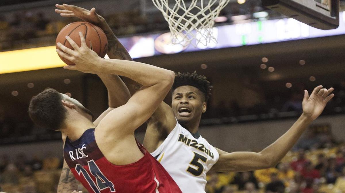 Missouri’s Mitchell Smith (right), who blocked the shot of Arizona’s Dusan Ristic in a Dec. 10 loss, is out for the season.