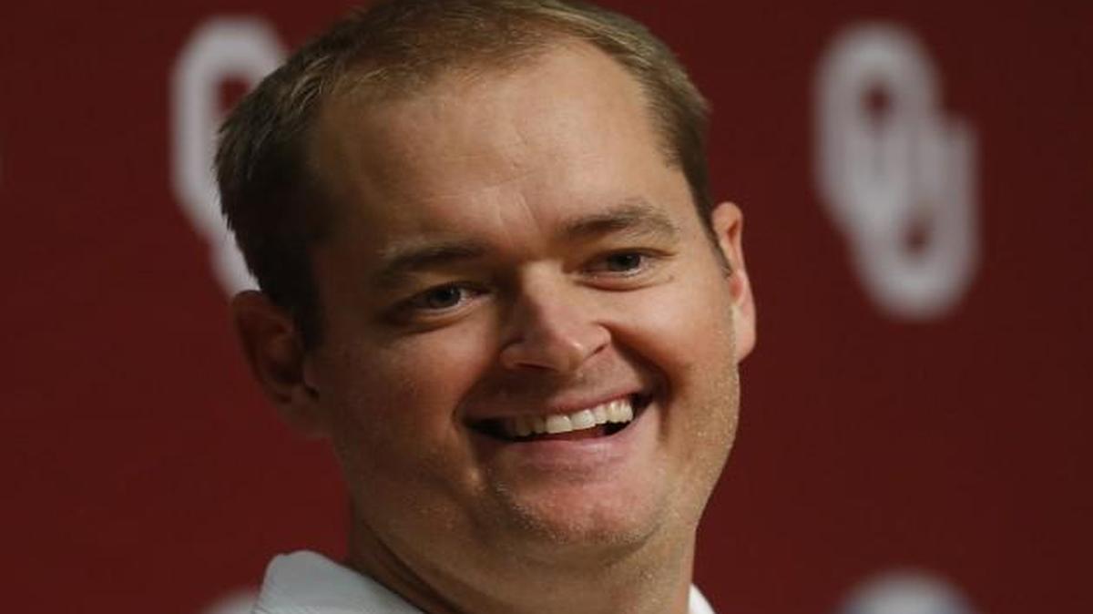 In this 2014 photo, Josh Heupel, Oklahoma co-offensive coordinator and quarterbacks coach, answered a question during media day in Norman, Okla.