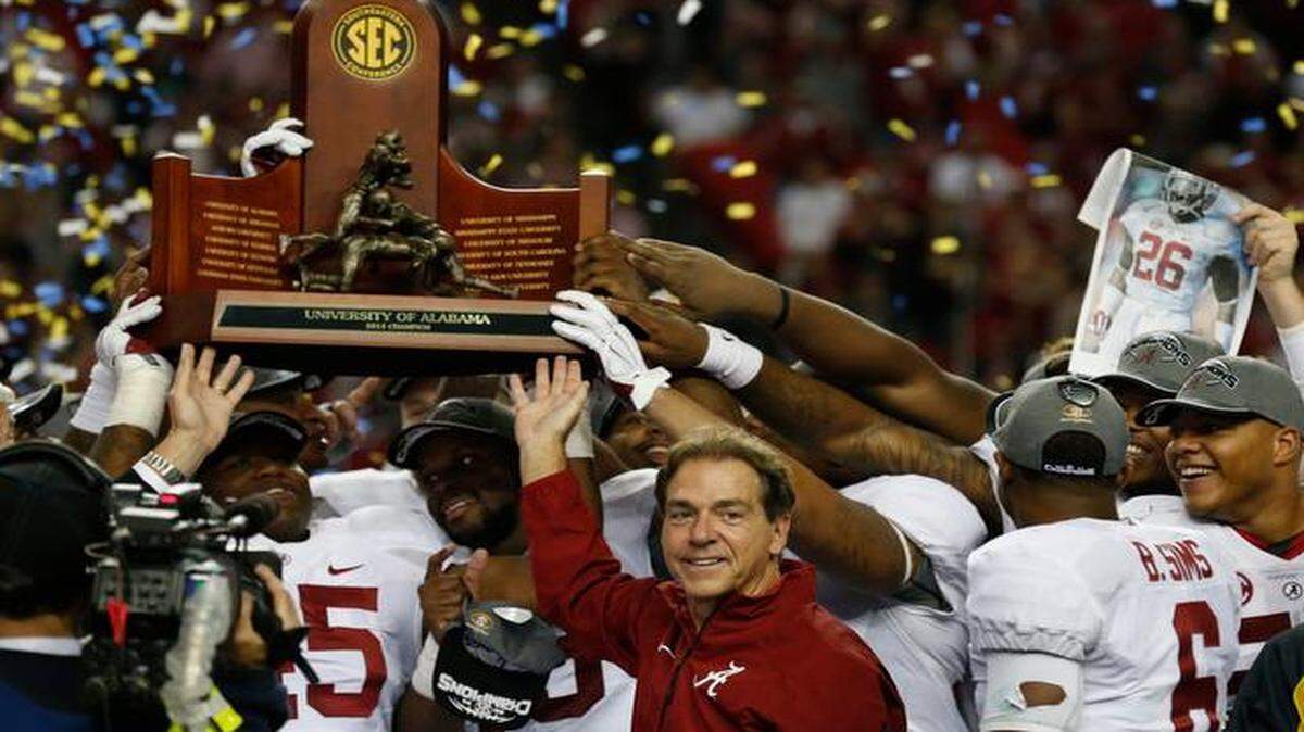
Alabama head coach Nick Saban and his players hoisted the trophy after the No. 1 Crimson Tide beat No. 14 Missouri 42-13 to win the Southeastern Conference Championship on Saturday in the Georgia Dome in Atlanta.
