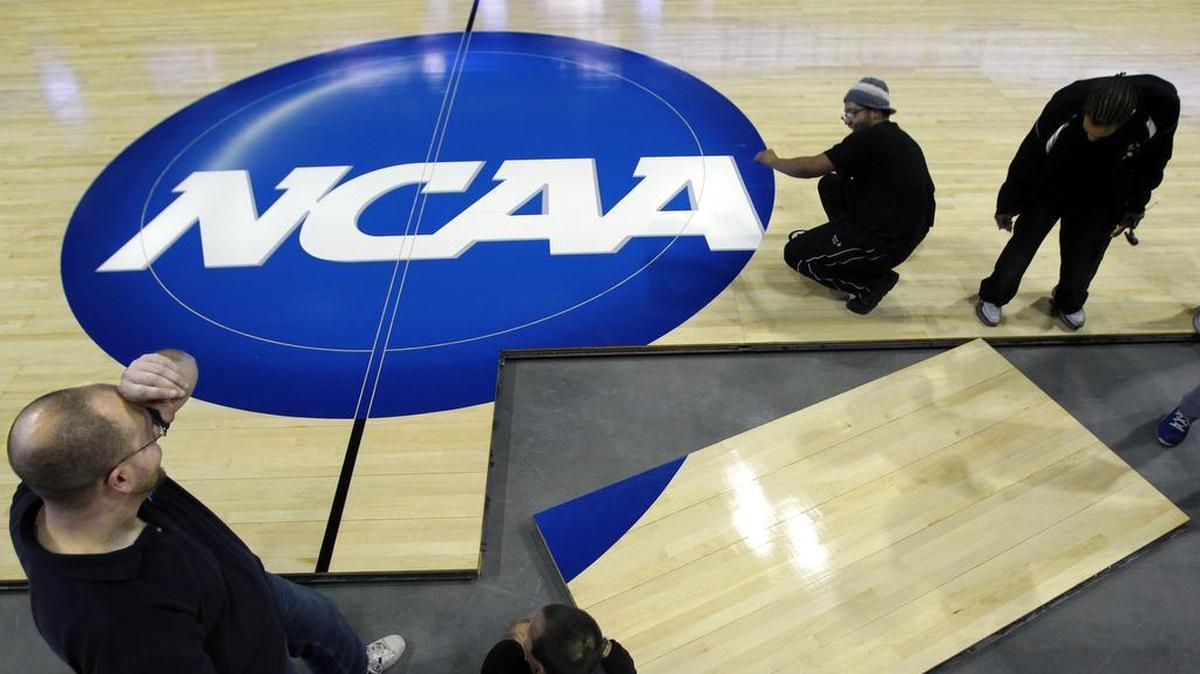 Workers pieced together the floor for 2013 NCAA Tournament games at the Sprint Center.