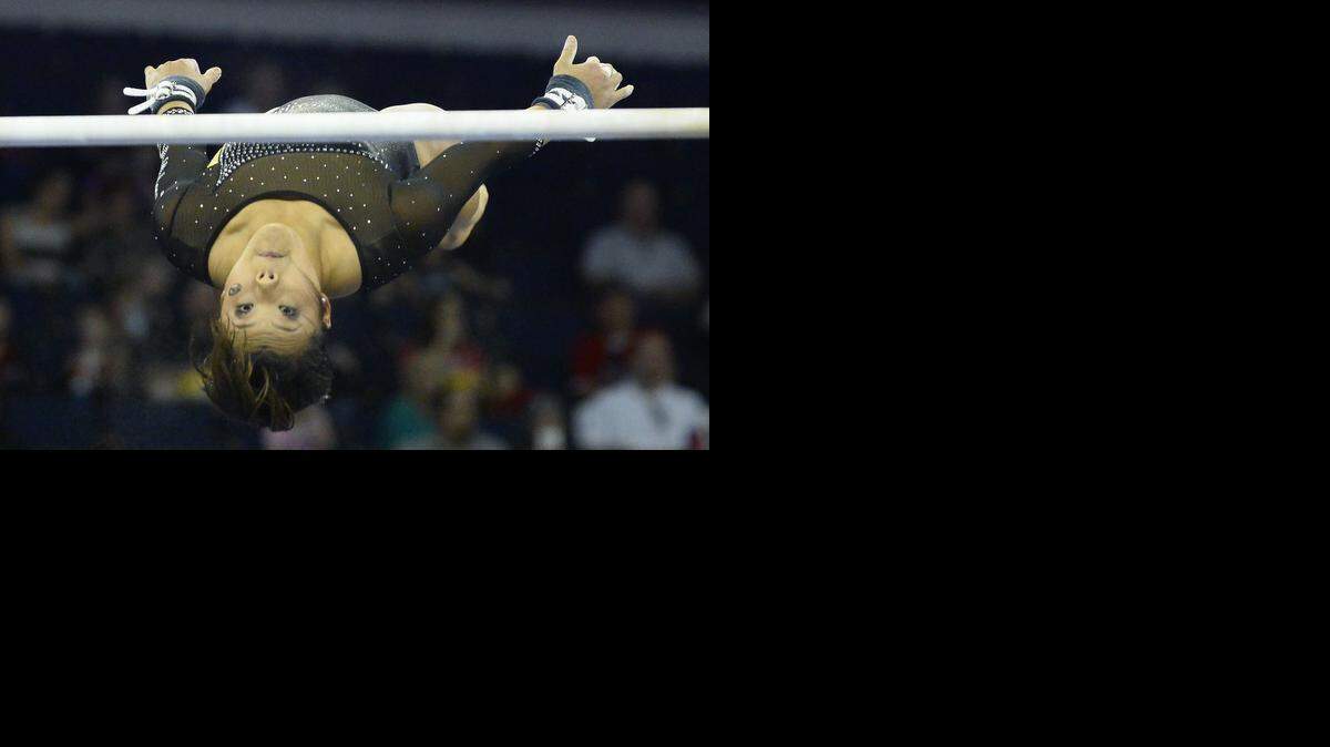 
Missouri's Katelyn Trevino performed on the uneven bars during the SEC gymnastics championship Saturday in Duluth, Ga. 
