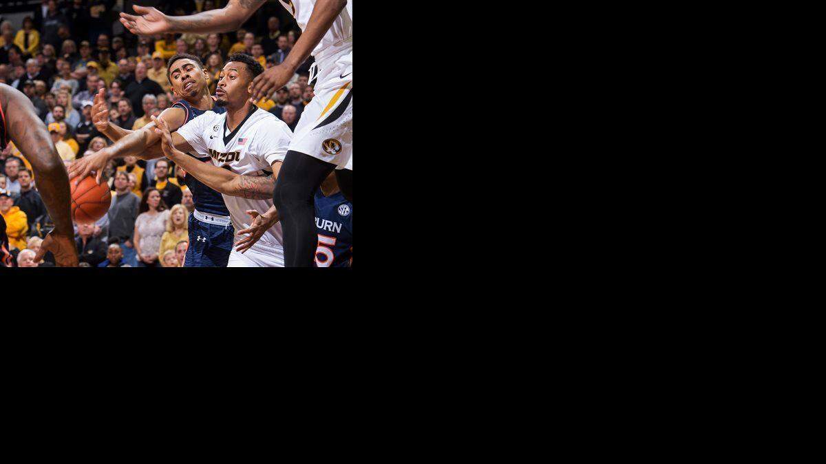 
Missouri's Johnathan Williams III (right) had the ball knocked out of his hands by Auburn's TJ Lang in Missouri's 63-61 win on March 3 in Columbia, Mo. 
