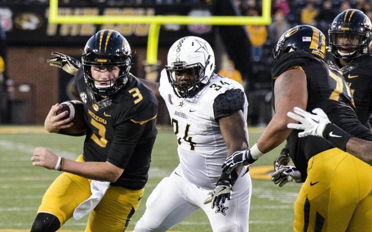 Missouri quarterback Drew Lock (left) is back to direct the Tigers’ offense, which set a program record for yards per game last season.