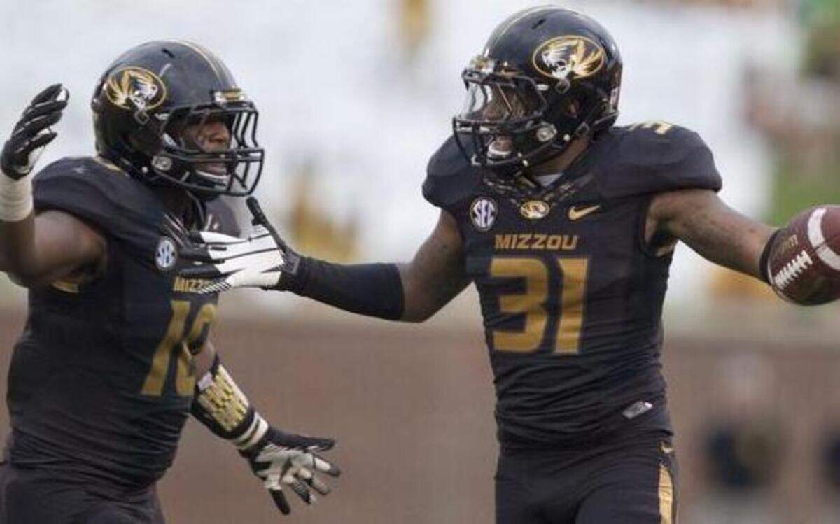 
Missouri’s Kentrell Brothers and E.J. Gaines celebrated after Gaines picked off a pass in in 2013.
