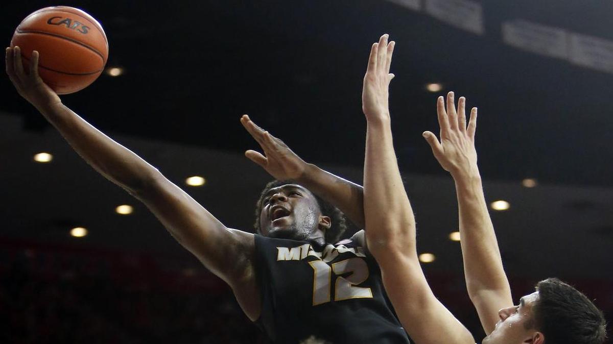 Namon Wright (left) will be in Missouri’s starting lineup Wednesday when the Tigers face Illinois in the 35th Annual Braggin’ Rights Game in St. Louis. Last Sunday, Wright shot over Arizona center Dusan Ristic in a game in Tucson, Ariz.
