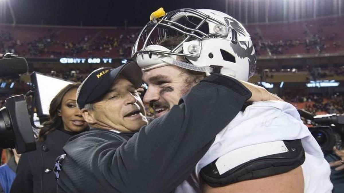 Missouri head coach Gary Pinkel shared a hug with offensive lineman Connor McGovern after the Tigers beat BYU at Arrowhead Stadium. Sadly, McGovern’s time at the Senior Bowl was cut short Tuesday by a hamstring injury during practice.