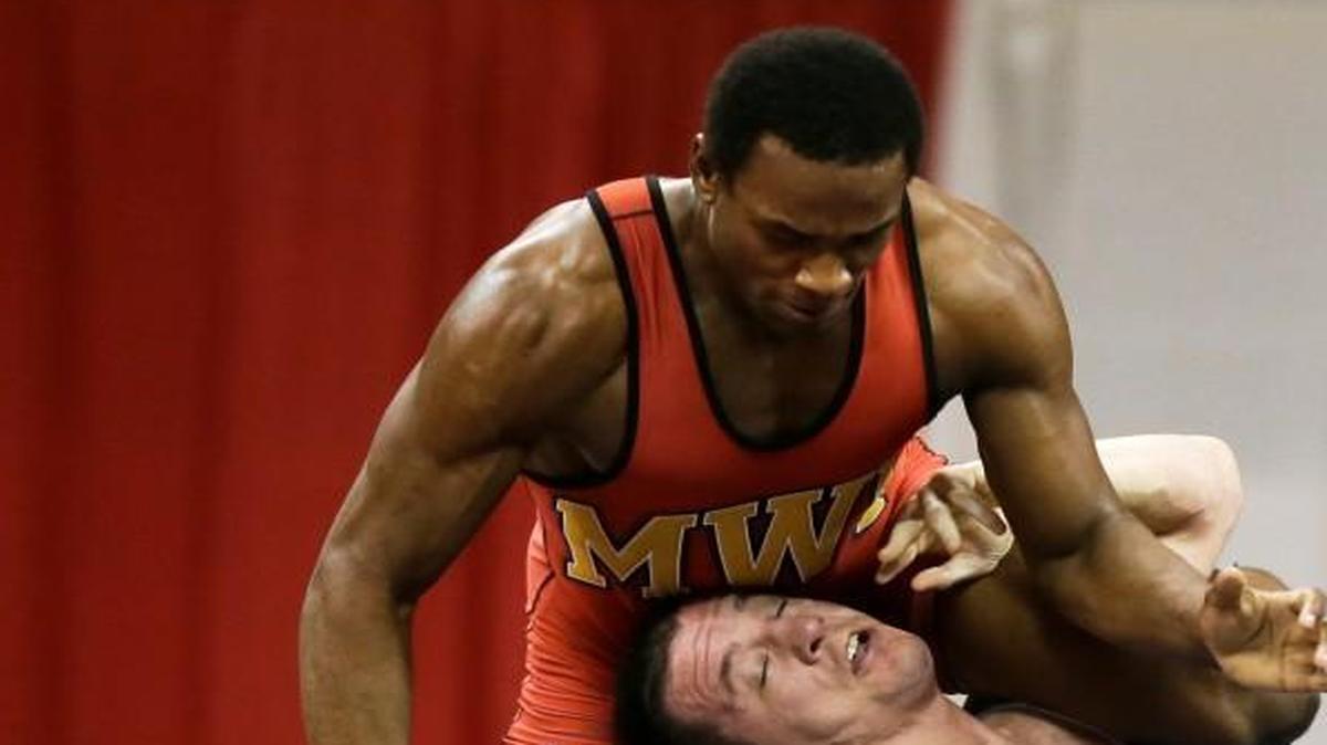 Missouri junior J’Den Cox (left) took down Keith Gavin during their 86-kilogram freestyle match Sunday at the U.S. Olympic Wrestling Team Trials in Iowa City, Iowa.