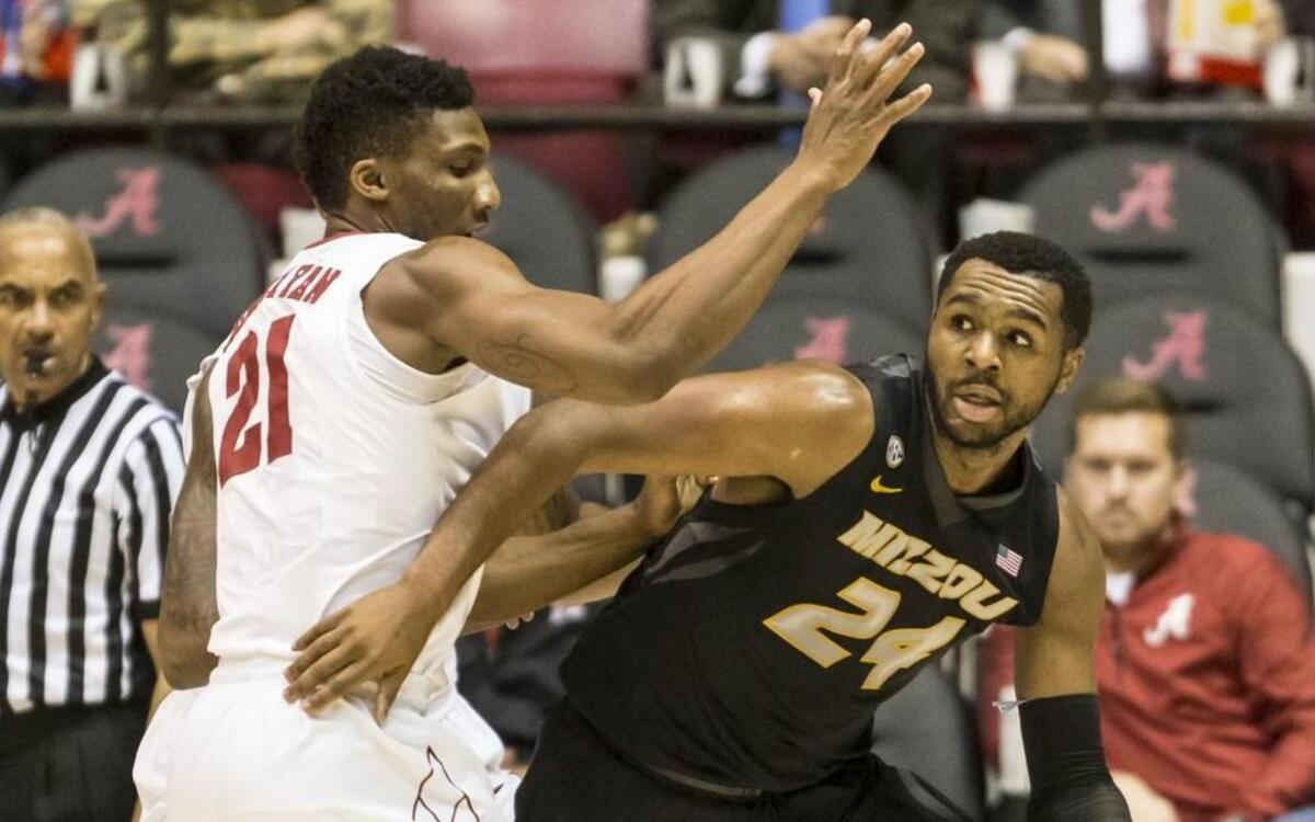 Missouri forward Kevin Puryear (right) looked to get past Alabama forward Bola Olaniyan during a game earlier this month.