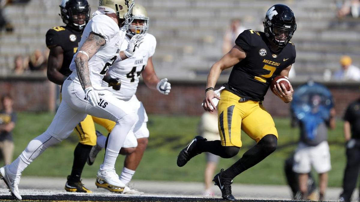 Missouri quarterback Micah Wilson runs with the ball during the second half of the Tigers’ victory against Idaho on Oct. 21, 2017, in Columbia.