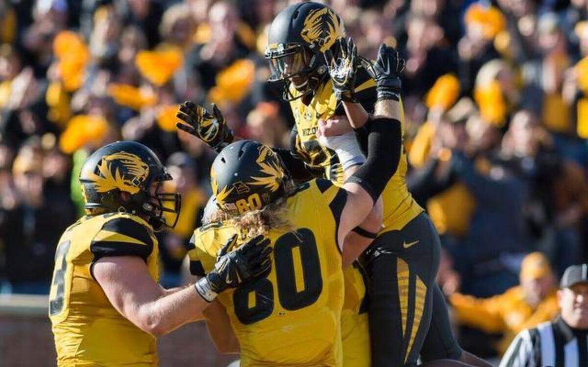 
The Missouri offense gathered to congratulate Tigers wide receiver Bud Sasser (21) on his second-quarter touchdown against Kentucky on Saturday in Columbia.
