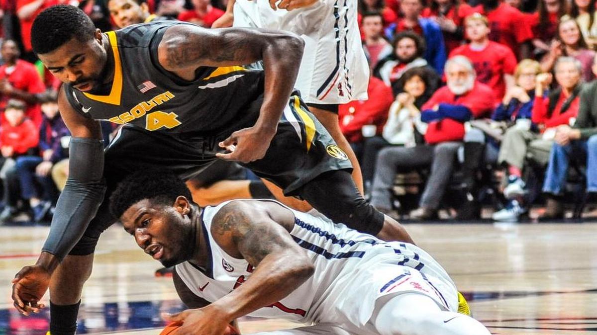 Missouri guard Tramaine Isabell (4) and Mississippi guard Martavious Newby battled for the ball as the Tigers and Rebels played Tuesday night in Oxford, Miss. Isabell scored a career-high 17 points in the Tigers’ 85-76 loss.