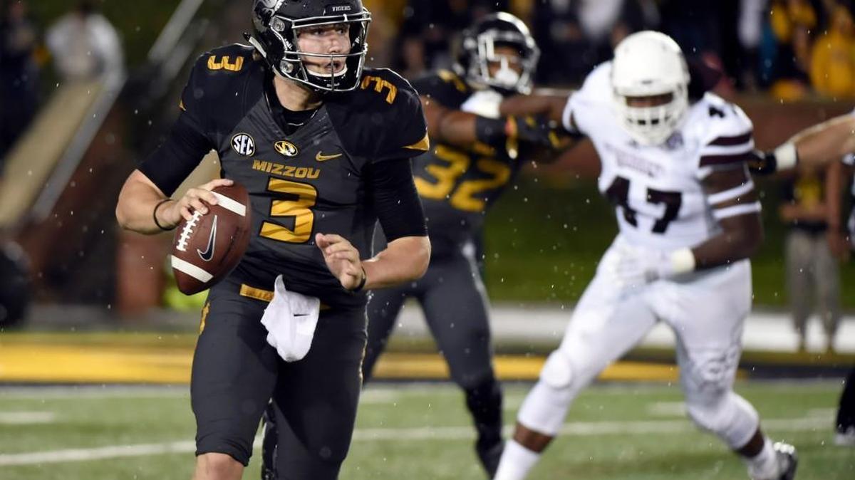Missouri quarterback Drew Lock scrambled away from Mississippi State defenders during their game earlier this month.