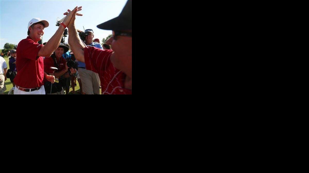 
Alabama’s Trey Mullinax high-fives Peter Kern after Mullinax sank a putt on the 17th green in the finals of team match play at the NCAA men’s golf championships on Wednesday. Mullinax’s putt secured Alabama’s second consecutive title, a 4-1 victory over Oklahoma State. 
