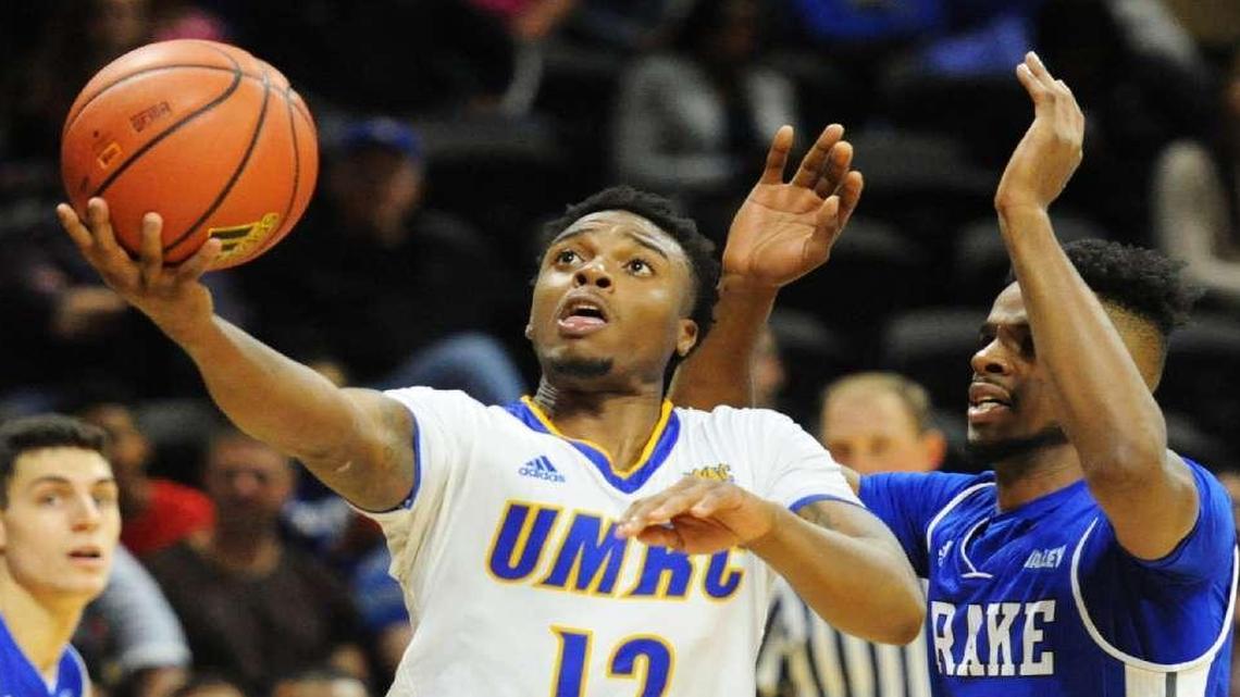 UMKC’s Martez Harrison (left) made a layup against Drake on Nov. 15 at Municipal Auditorium. Harrison has been dismissed from the team.