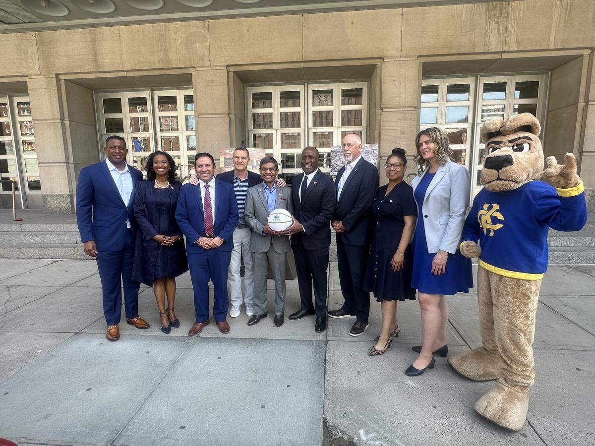 Some of Kansas City’s elected officials and UMKC personnel pose for a picture in front of Municipal Auditorium downtown on Tuesday, May 12. In a partnership between the city and the university, Municipal Auditorium will be the home of the Roos men's basketball team for the 2026-27 season.