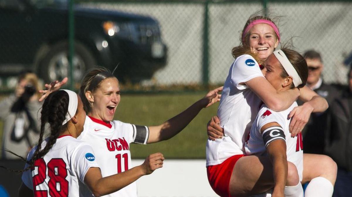 Abby Rhodes (right) lifted up Megan Woolley after assisting Woolley on Central Missouri's first goal Thursday at Swope Soccer Village. Central Missouri advanced to the NCAA DII national championship game with a 3-0 win over Mercy.