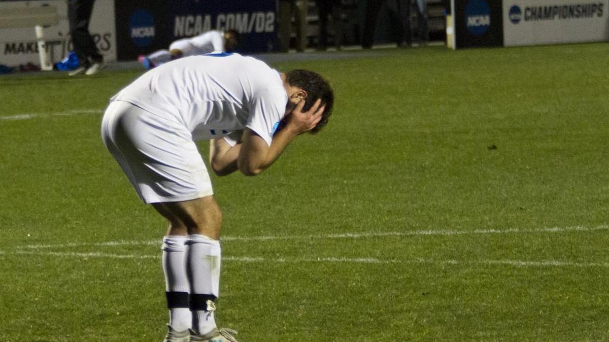 Sal Caruso of Rockhurst reacts after missing his shot in a shootout Thursday against Lynn in the NCAA Division II semifinals. Two Hawks missed another got blocked as Lynn advanced to the finals 3-0 in the shootout after a scoreless draw.