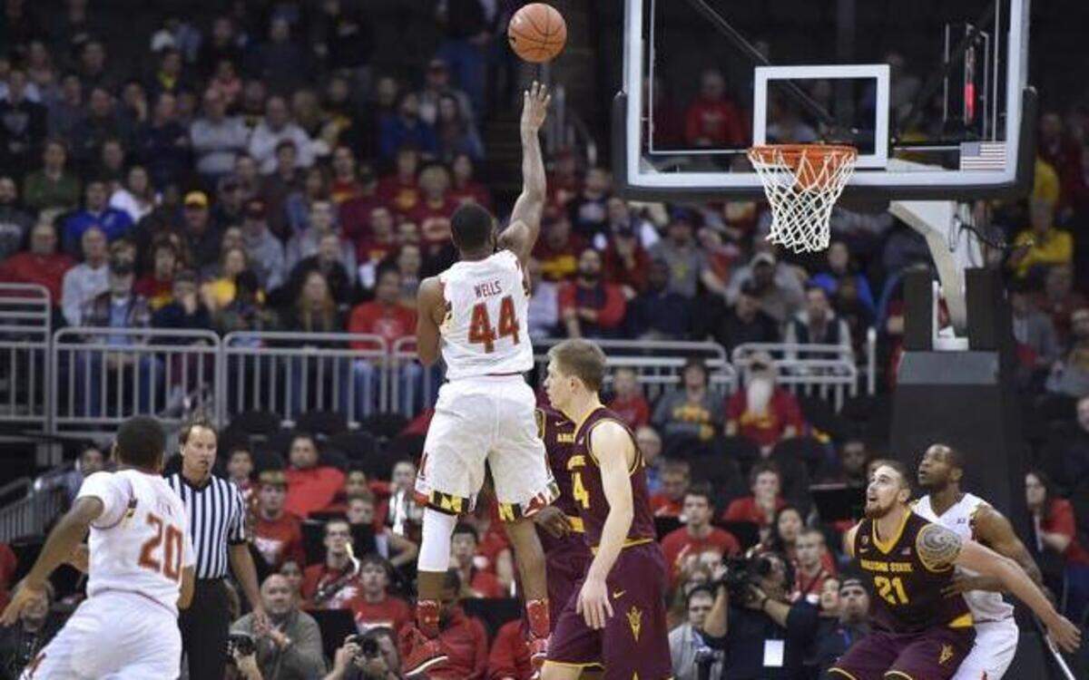 
No one bothered to put a hand in the face of Maryland's Dez Wells (44) and he made Arizona State pay by canning this runner in the lane, late in Monday night's CBE Hall of Fame Classic at the Sprint Center.
