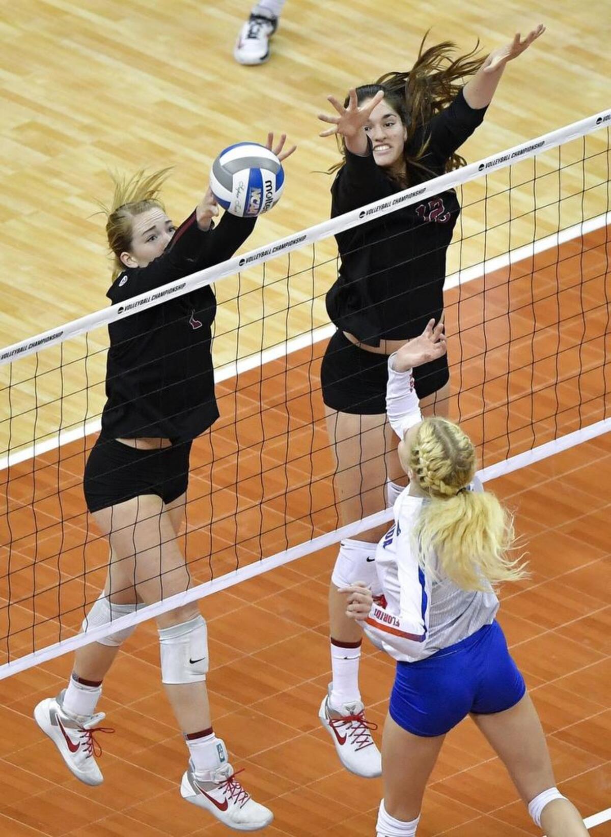 Stanford setter Jenna Gray, left, goes up for a block against Florida in the NCAA Volleyball Final Four at the Sprint Center.