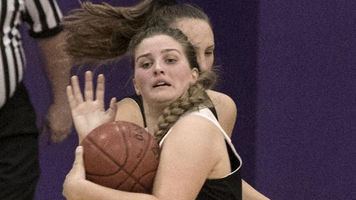 Raymore-Peculiar senior and Missouri All-Star Shelby Martinez fought to keep the ball from a Kansas player April 13 during the Kansas vs. Missouri High School All Star Challenge at Avila University. Martinez scored four points in a 66-63 overtime victory for the Missouri girls.