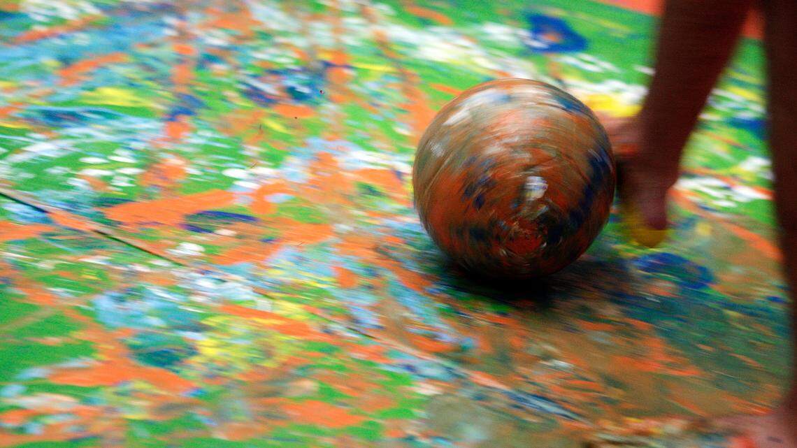 KANSAS CITY, MO - JANUARY 11:  A detail of a painted ball being kicked across the canvas as MLS SuperDraft Prospects Tony Cascio, Nick DeLeon, Sam Garza, Chandler Hoffman, Luis Silva, and Casey Townsend participate In "Creating The Beautiful Game" Art Exhibition on January 11, 2012 at Nelson-Atkins Museum of Art in Kansas City, Missouri. 